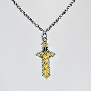 Minecraft Sword Necklace with pale yellow, green, orange, black enameled inlay.